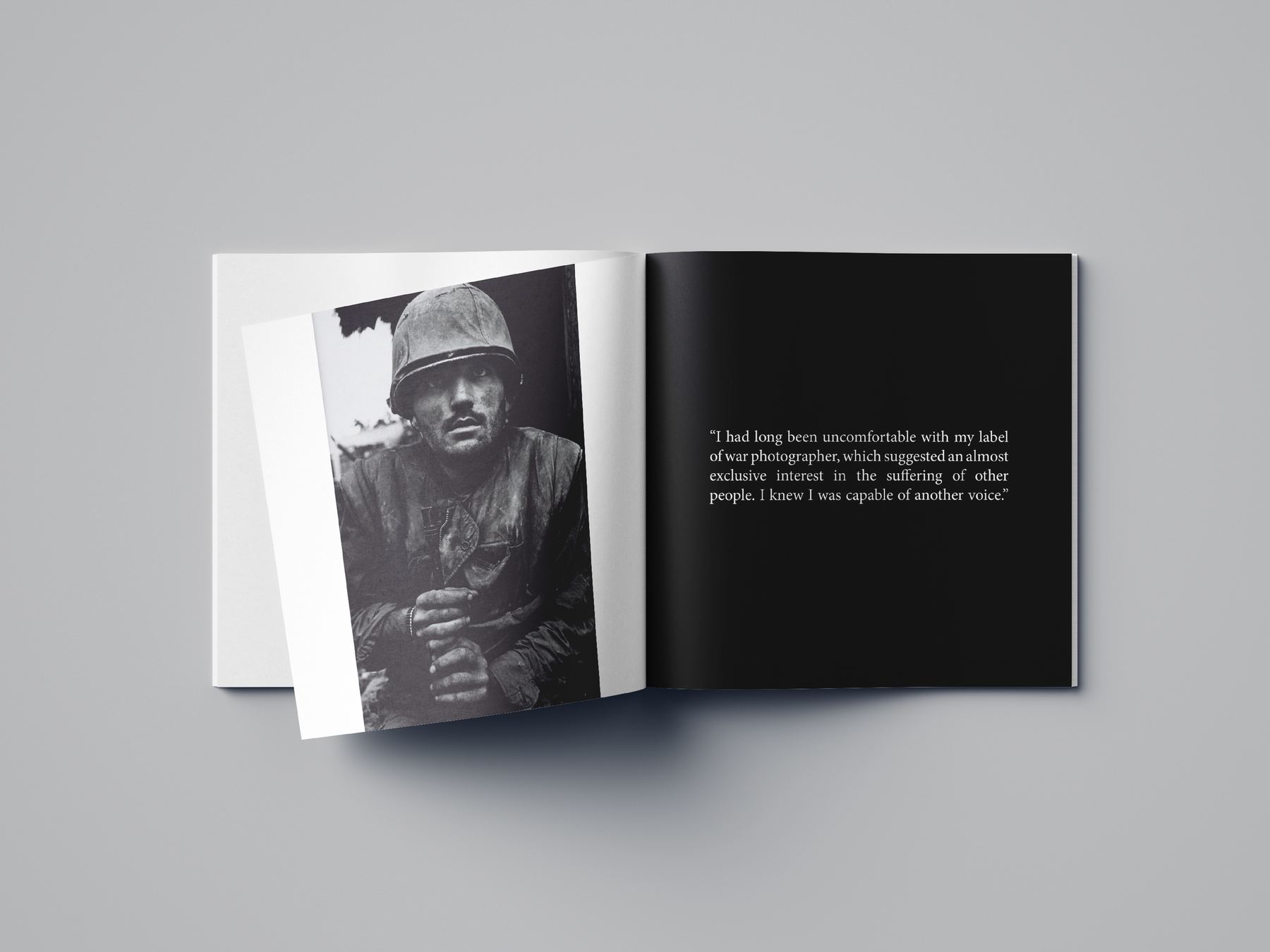 Black spread with a photograph of a worker facing a block of set text