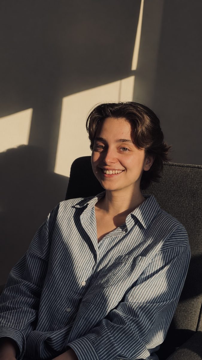 Portrait of Setayesh Ahmadi seated in afternoon window light